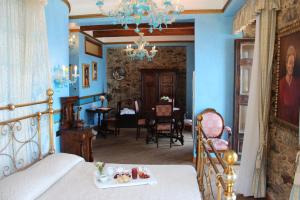 a bedroom with a bed and a dining room at Principe Di Scilla in Scilla