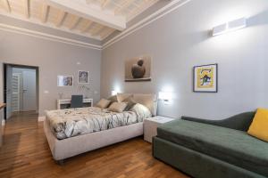 Postel nebo postele na pokoji v ubytování Firenze Rentals Deluxe Corso 5