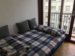 Postel nebo postele na pokoji v ubytování Amazing Flat in the heart of Geneva