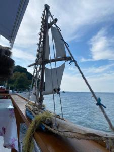 a model sail boat on a wooden boat in the water at Βίλα Κατερίνα - Villa Katerina in Kókkinon Nerón +48 photos