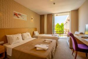 Postel nebo postele na pokoji v ubytování Zeytin Bahcesi Hotel