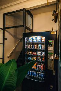 a vending machine filled with drinks and sodas at Winston B&B in Eindhoven