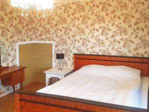 Postel nebo postele na pokoji v ubytování Holiday home Leinøy
