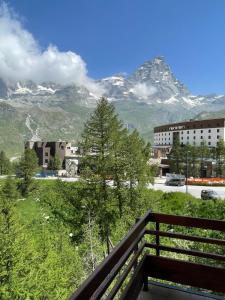 a view of a mountain range from a balcony at Baita del Cervino CIR n 0016 in Breuil-Cervinia