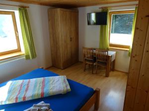 Postel nebo postele na pokoji v ubytování Gästehaus Posch