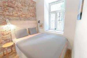 Postel nebo postele na pokoji v ubytování Urban Nest Apartments Blich 8