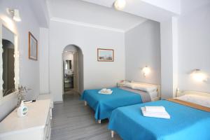 Postel nebo postele na pokoji v ubytování Dimitris Villa