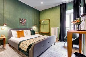 A bed or beds in a room at Ripetta Natural Suites