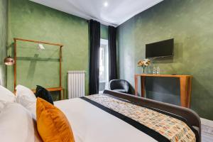 A bed or beds in a room at Ripetta Natural Suites