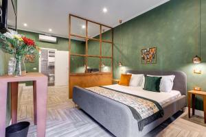 A bed or beds in a room at Ripetta Natural Suites