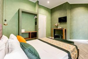 A bed or beds in a room at Ripetta Natural Suites