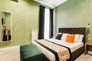A bed or beds in a room at Ripetta Natural Suites