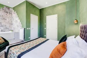 A bed or beds in a room at Ripetta Natural Suites