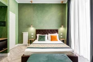 A bed or beds in a room at Ripetta Natural Suites