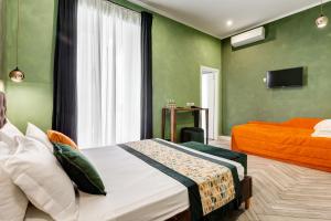 A bed or beds in a room at Ripetta Natural Suites