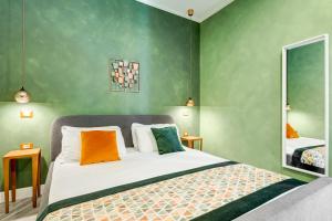 A bed or beds in a room at Ripetta Natural Suites