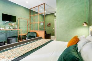 A bed or beds in a room at Ripetta Natural Suites
