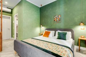 A bed or beds in a room at Ripetta Natural Suites