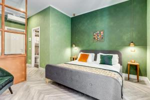 A bed or beds in a room at Ripetta Natural Suites