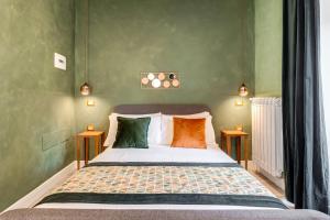 A bed or beds in a room at Ripetta Natural Suites