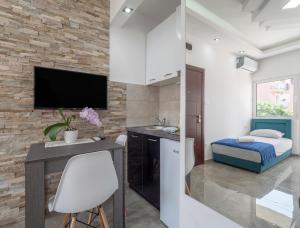 TV a/nebo společenská místnost v ubytování Casa di Fratelli