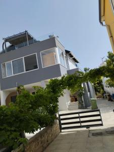 a building with a bench in front of it at Apartment Sun in Vir