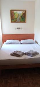 Кровать или кровати в номере BranySol Apartman