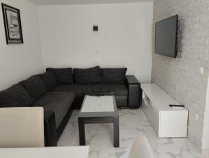 a living room with a couch and a table at Apartment Sun in Vir