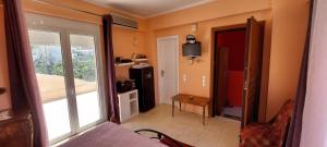 a room with a view of a room with a window at Anastacias Apartment in Artemida