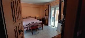 Posteľ alebo postele v izbe v ubytovaní Anastacias Apartment