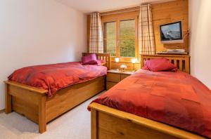 Postel nebo postele na pokoji v ubytování Chalet Bergrose 4