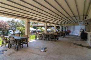 a dining room with tables and chairs and a large ceiling at Alesta Yacht Hotel in Fethiye