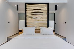 Rúm í herbergi á Elements Cozy Suites Pyrgos