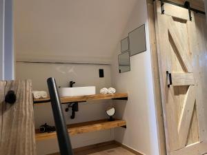 Vannituba majutusasutuses Het Koerhuis