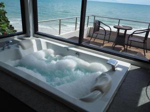 a bath tub filled with snow in front of a window at Du Talay Hotel Koh Chang in Ko Chang