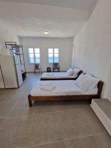 a bedroom with two beds in a room at Panorama of seladi in Kástron