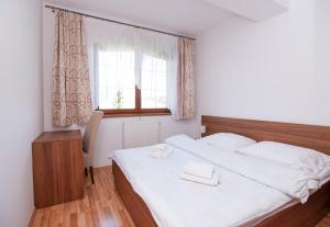 Posteľ alebo postele v izbe v ubytovaní Apartmany Sileas