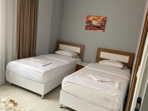Una cama o camas en una habitación de Senturkler Suite