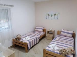 Postel nebo postele na pokoji v ubytování Borche Apartments