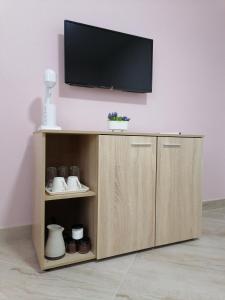 TV a/nebo společenská místnost v ubytování Borche Apartments