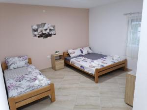 Postel nebo postele na pokoji v ubytování Borche Apartments