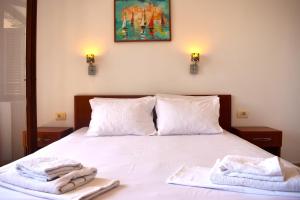 Postel nebo postele na pokoji v ubytování Apartments Aga