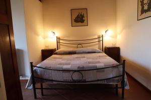 Tempat tidur dalam kamar di Relais Cà Nova Guest House