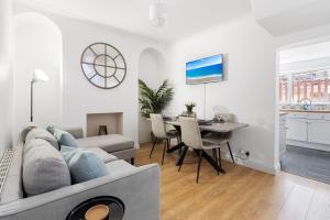 a living room with a couch and a table at City Reach in Dean