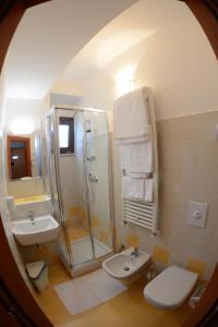a bathroom with a shower and a toilet and a sink at B&B Europa in Potenza