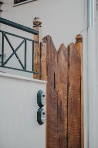 a wooden fence on the side of a building at Varousi.Traditional house in old town of Trikala 1 in Tríkala