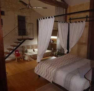 Łóżko lub łóżka w pokoju w obiekcie Le Clos de La Pinsonnière