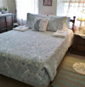 a bed with two pillows on it in a bedroom at Great Location! 4 Bedroom 2 bath sleeps 10 in Cape May