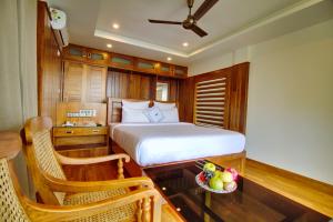 מיטה או מיטות בחדר ב-Chandys Drizzle Drops - Munnar Top Station