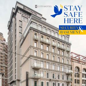 a building with a sign that reads stay safe here security and assessment at CITYHOTEL in Kyiv